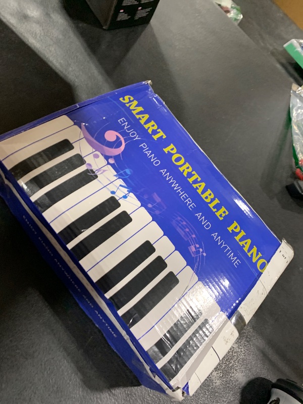 Photo 1 of POGOLAB 88 Keys Roll Up Keyboard Piano, Portable Electric Foldable Piano with Sustain Pedal, 14 Songs, 128 Tones, 128 Rhythms, Rechargeable & Dual BT Function, Music Gift for Beginners
