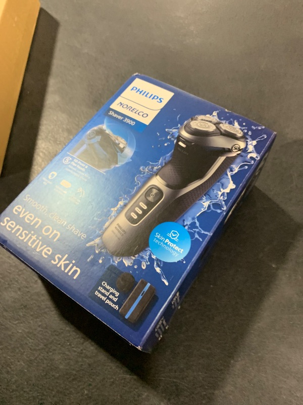 Photo 1 of Philips Norelco Shaver 3900 Series, Wet and Dry Electric Shaver, P-Cap, Travel Pouch, Charging Stand, Storm Blue, Model S3341/92
