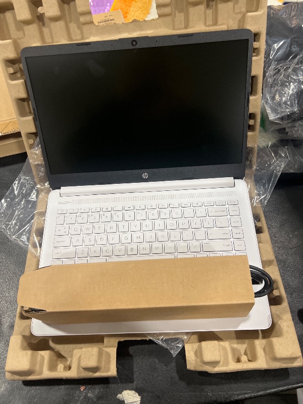 Photo 1 of HP 14 Laptop, Intel Celeron N4020, 4 GB RAM, 64 GB Storage, 14-inch Micro-edge HD Display, Windows 11 Home, Thin & Portable, 4K Graphics, One Year of Microsoft 365 (14-dq0040nr, Snowflake White)