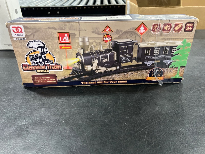 Photo 1 of JUQU Electric Train Set for Kids Ages 4-8 – Christmas Tree Train Set with Locomotive Engine, Cars, Tracks & Accessories, Classic Toy Trains for Boys & Girls for Around or Under Tree
