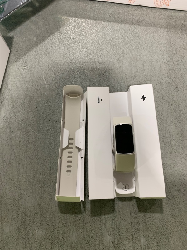 Photo 1 of Fitbit Charge 6 Fitness Tracker with Google apps, Heart Rate on Exercise Equipment, 6-Months Premium Membership Included, GPS, Health Tools and More, Porcelain/Silver, One Size (S & L Bands Included)