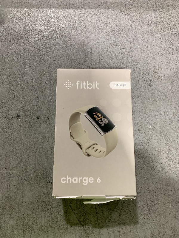 Photo 1 of Fitbit Charge 6 Fitness Tracker with Google apps, Heart Rate on Exercise Equipment, 6-Months Premium Membership Included, GPS, Health Tools and More, Porcelain/Silver, One Size (S & L Bands Included)