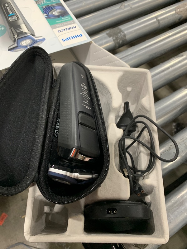 Photo 1 of Philips Norelco Shaver 7300, Rechargeable Wet & Dry Electric Shaver with SenseIQ Technology, Pop-up Trimmer, Charging Stand, Click-on Nose Trimmer, & Travel Case, S7887/92