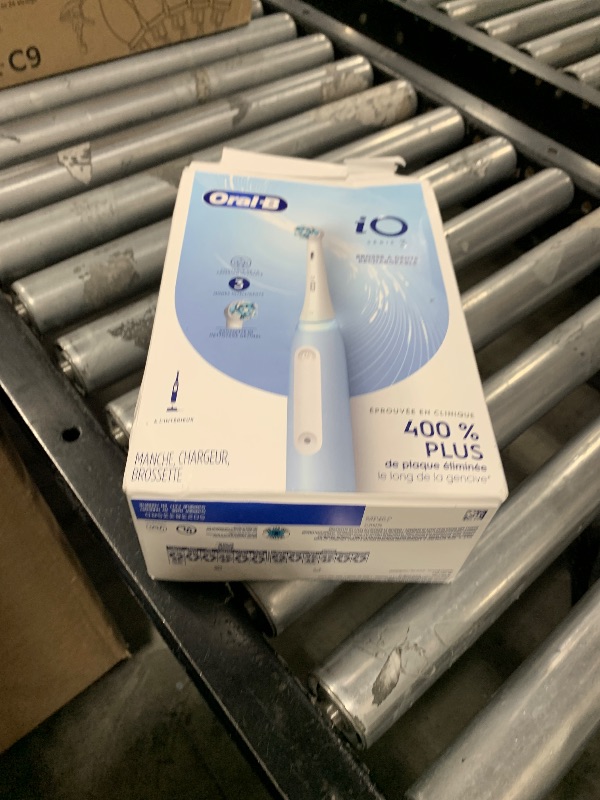 Photo 1 of Oral-B iO3 Electric Toothbrush (1) with (1) Ultimate Clean Brush Head and (1) Charger, Blue