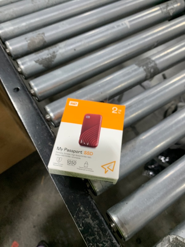 Photo 1 of Western Digital 2TB My Passport SSD Portable External Solid State Drive, Red, Sturdy and Blazing Fast, Password Protection with Hardware Encryption - WDBAGF0020BRD-WESN