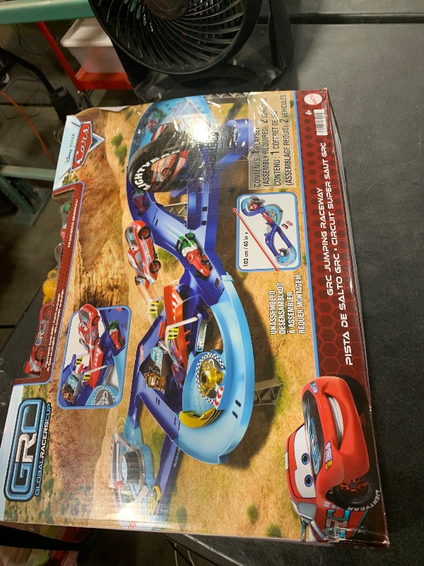 Photo 1 of Mattel Disney and Pixar Cars Playset with 2 Toy Cars, Lightning McQueen & Francesco Bernoulli, GRC Jumping Raceway Track Set with Kid-Powered Booster