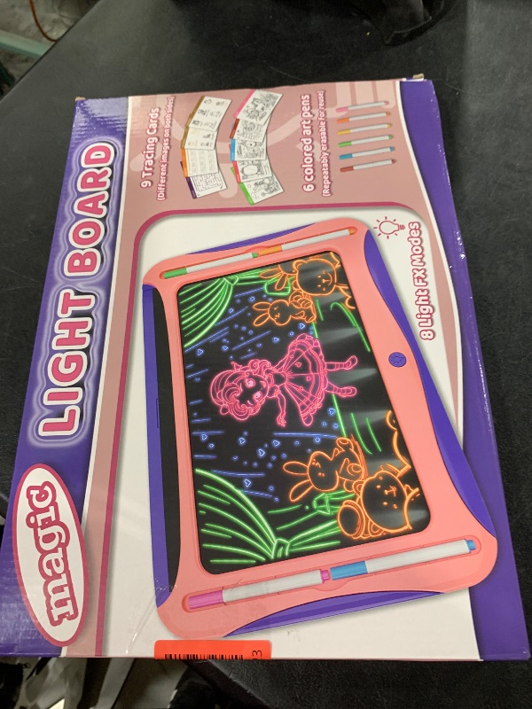 Photo 1 of Magic LED Drawing Board for Kids, Girls Toys Age 6-8, Light Up Tracing Pad with 9 Double-Sided Cards, 6 Washable Markers, Arts & Crafts Kits Learning Toy Glow Up Doodle Board Christmas Birthday Gifts