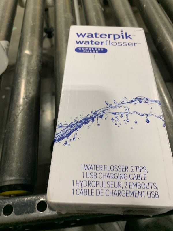 Photo 1 of Waterpik Cordless Pulse Rechargeable Portable Water Flosser for Teeth, Gums, Braces Care and Travel with 2 Flossing Tips, Waterproof, ADA Accepted, WF-20 Gray, Packaging May Vary