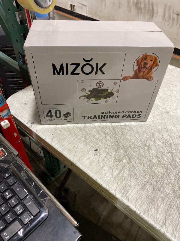 Photo 1 of MIZOK Pee Pads for Dogs - Large 28x34 Inches, Charcoal Puppy Pads, Absorbs Up to 8 Cups of Urine, 6-Layer Leak-Proof Wee Wee Pads (40 Counts)