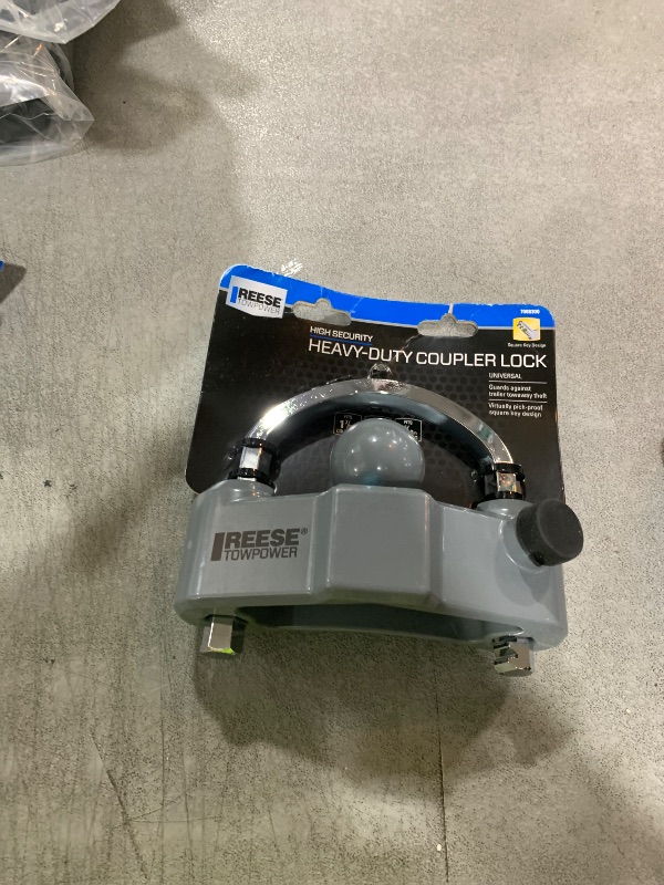 Photo 1 of Reese Towpower 7088300 Trailer Coupler Lock, Universal Fit, Heavy Duty, Designed to fit 1-7/8-in, 2-in, and 2-5/16-in couplers.