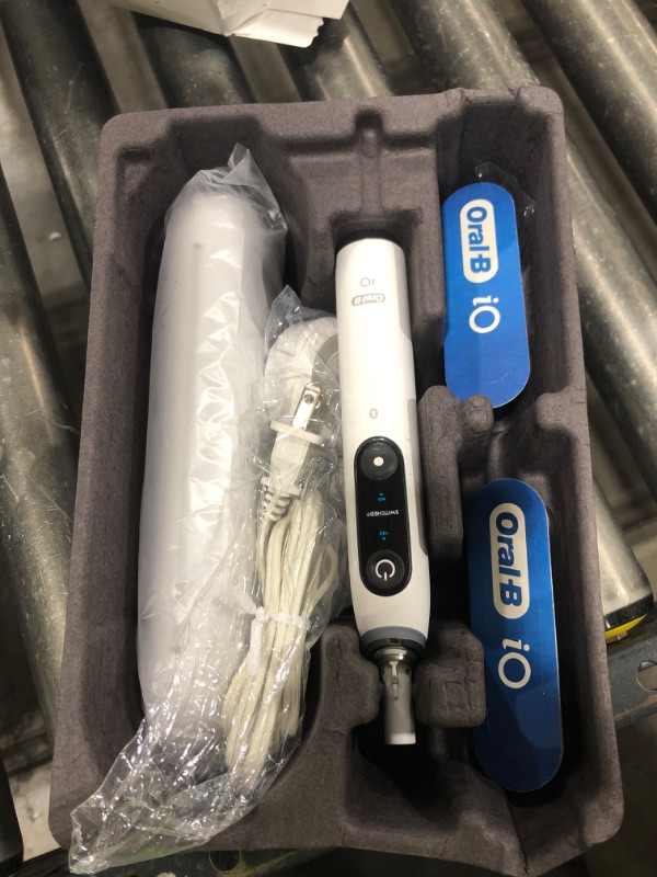 Photo 1 of Oral-B iO Series 8 Electric Toothbrush with 2 Replacement Brush Heads and Travel Case, Rechargeable Toothbrush, Whitealabaster