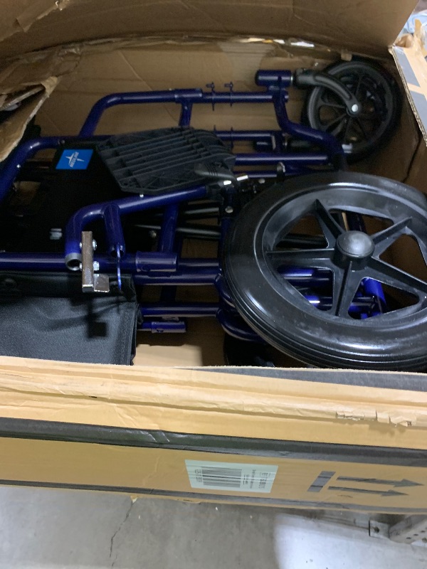 Photo 1 of Medline Heavy Duty Transport Chair supports up to 500 lbs., Bariatric Transport Wheelchair, 22" x 18" seat, Blue Frame