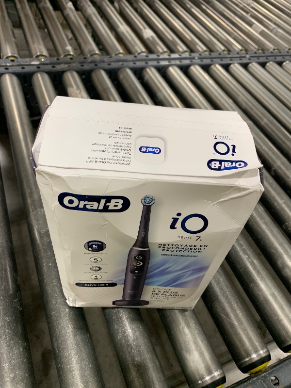 Photo 1 of Oral-B iO Deep Clean + Protect Rechargeable Electric Toothbrush, Black with a iO Series 7 Toothbrush, 2 Replacement Brush Heads, and a Charging Travel Case