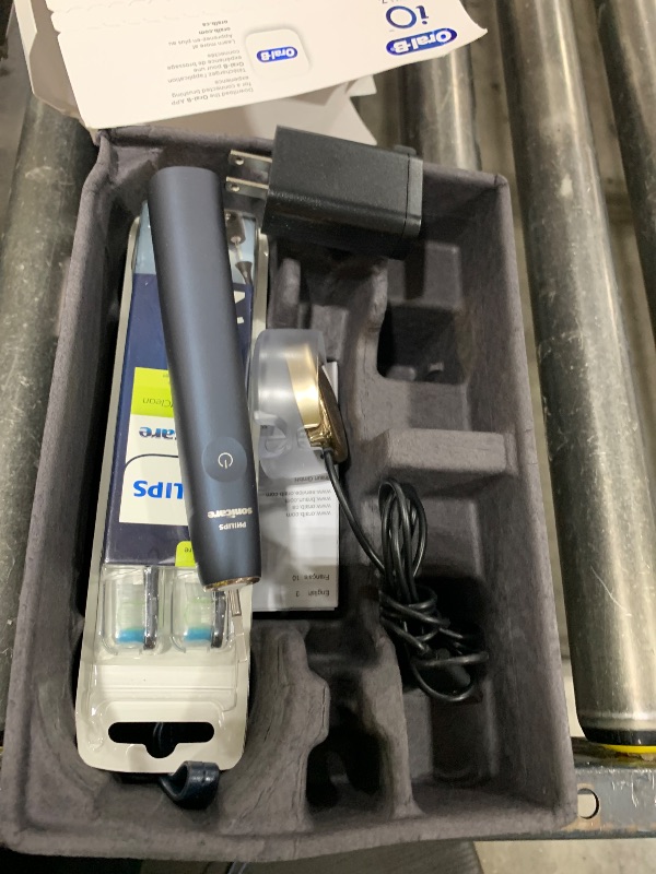 Photo 1 of Oral-B iO Deep Clean + Protect Rechargeable Electric Toothbrush, Black with a iO Series 7 Toothbrush, 2 Replacement Brush Heads, and a Charging Travel Case