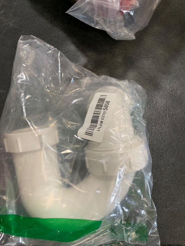 Photo 1 of 1-1/2 Inches PVC DWV P-Trap Drain Pipe with Union for bathroom sink White