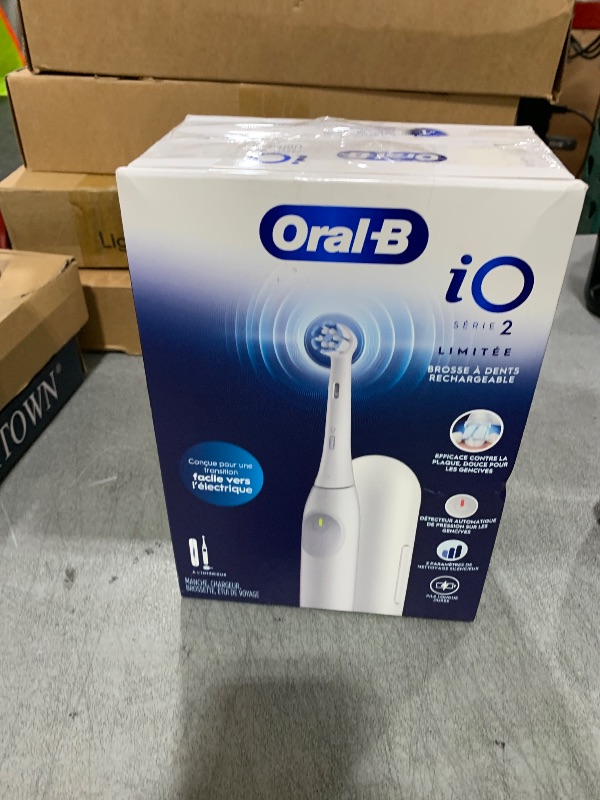 Photo 1 of Oral-B iO Simple Clean Rechargeable Electric Powered Toothbrush, Pure White with 1 Gentle Care Brush Head and 1 White Travel Case - Automatic Pressure Sensor to Protect Gums - 3 Modes -2 Min Timer