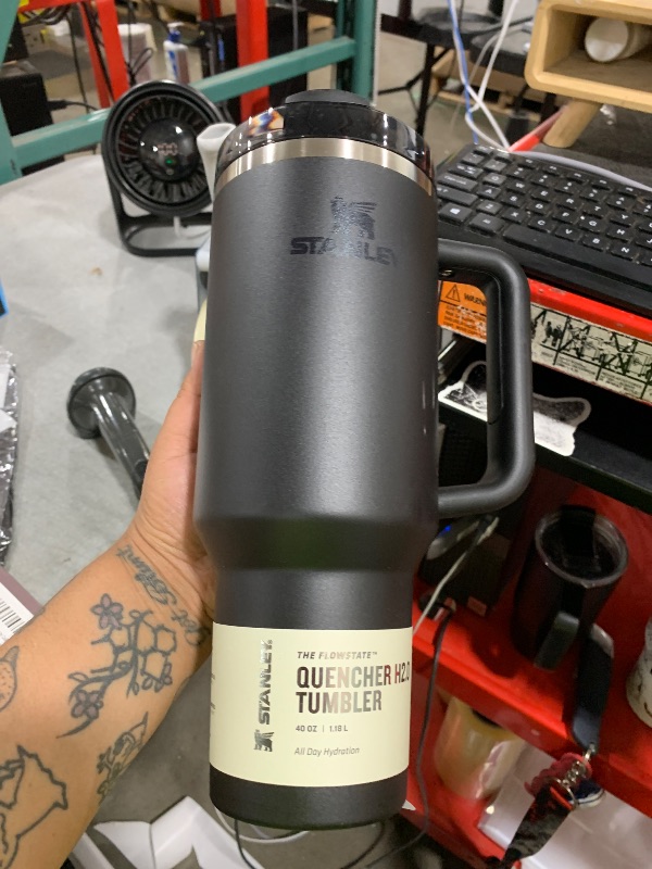 Photo 1 of STANLEY Quencher H2.0 Tumbler with Handle and Straw 40 oz | Flowstate 3-Position Lid | Cup Holder Compatible for Travel | Insulated Stainless Steel Cup | BPA-Free | Black 2.0