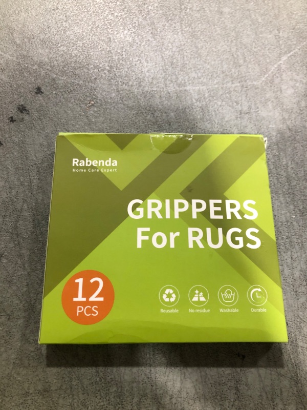 Photo 1 of Rabenda 12 Pcs Rug Tape, Non Slip Rug Pads Grippers for Hardwood Floors and Tiles, Reusable Carpet Tape for Area Rugs, Double-Sided Adhesive Rug Stickers Keep Corners Flat (Black)