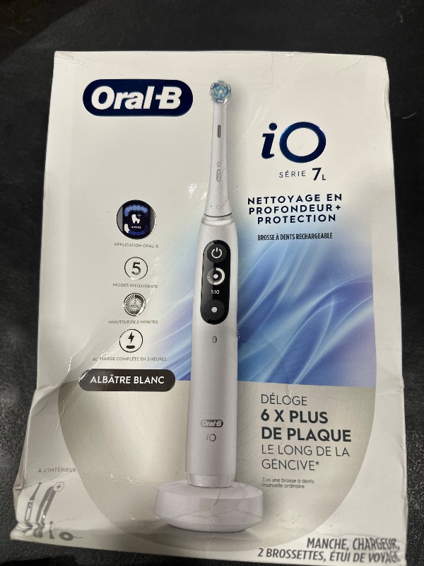 Photo 1 of Oral-B iO Deep Clean + Protect Rechargeable Electric Toothbrush, White with a iO Series 7 Toothbrush, 2 Replacement Brush Heads, and a Charging Travel Case