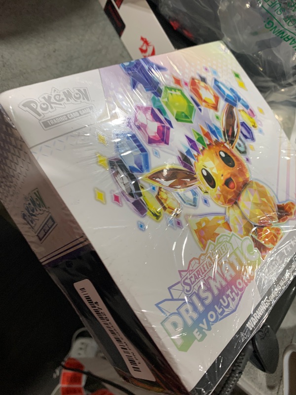 Photo 1 of Pokemon Scarlet & Purple Elite Trainer Set - Prismatic Evolutions of The Pokemon TCG (1 Fully Illustrated Promo Card, 9 Booster Packs & Premium Game Accessories)
