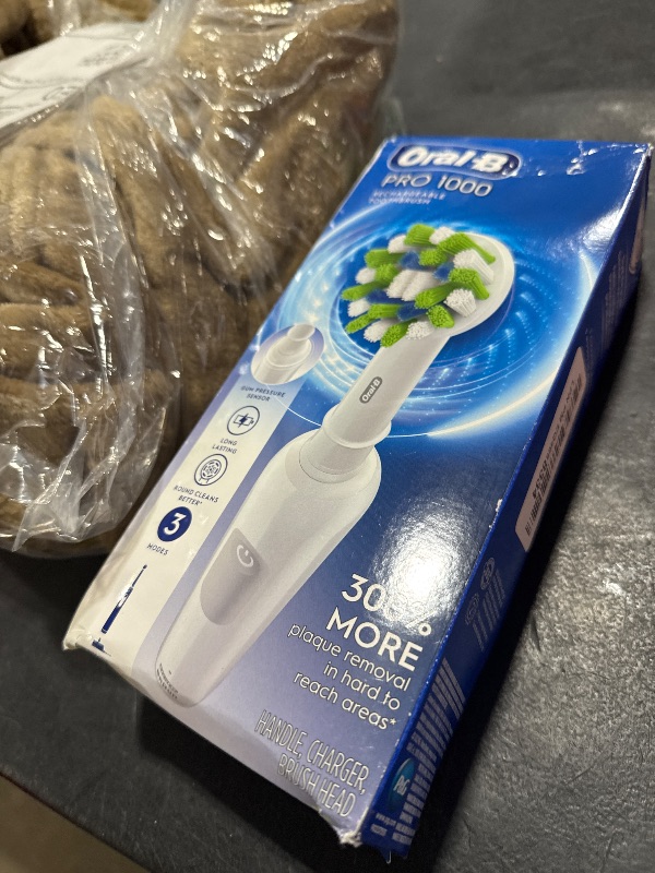 Photo 1 of Oral-B Pro 1000 Rechargeable Electric Toothbrush, White
