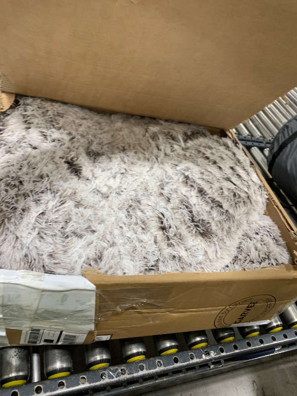 Photo 1 of Coohom Oval Calming Donut Cuddler Dog Bed,Shag Faux Fur Cat Bed Washable Round Pillow Pet Bed(30"/36"/43") for Small Medium Dogs (XXL(43"x34"x8"), Light Brown)