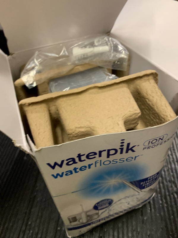 Photo 1 of Waterpik ION Professional Water Flosser, Rechargeable and Portable for Teeth, Gums, Braces, 10 Settings, 7 Flossing Tips For Multiple Users And Needs, ADA Accepted, WF-12 White, Packaging May Vary