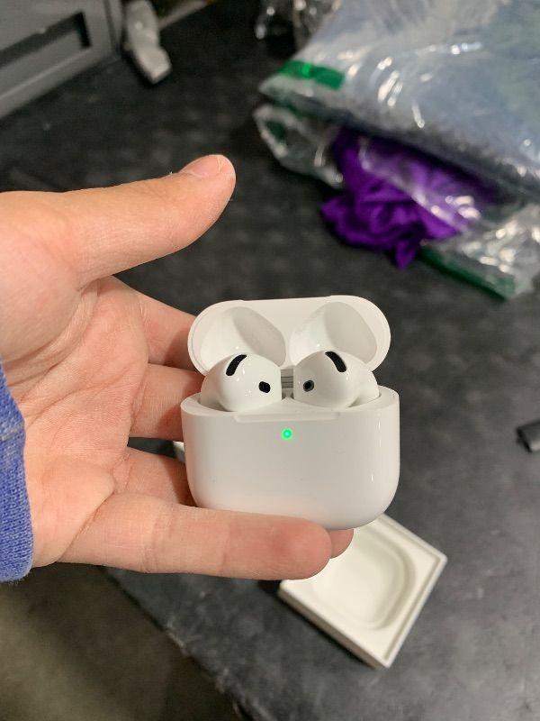 Photo 1 of Apple AirPods 4 Wireless Earbuds, Bluetooth Headphones, with Active Noise Cancellation, Adaptive, Transparency Mode, Personalized Spatial Audio, USB-C Charging Case, Wireless Charging, H2 Chip