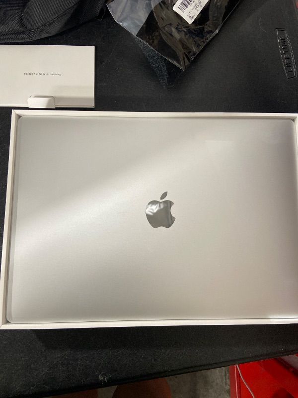 Photo 1 of 2020 Apple MacBook Air Laptop: Apple M1 Chip, 13” Retina Display, 8GB RAM, 256GB SSD Storage, Backlit Keyboard, FaceTime HD Camera, Touch ID. Works with iPhone/iPad; Silver