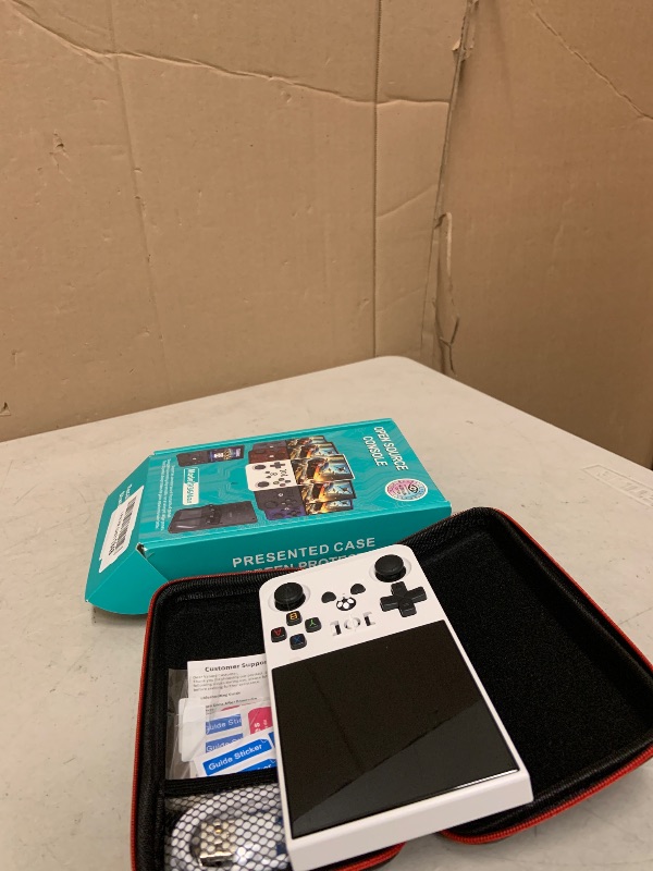 Photo 1 of R36MAX Retro Gaming Console, Retro Handheld Games Console with 64GB TF Card, Portable Hand Held Open Source Linux System, 4.0 inch IPS HD Screen Video Game Consoles, 4000mAh Battery (Light White)