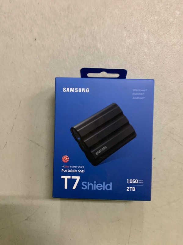Photo 1 of Samsung T7 Shield 2TB, Portable SSD, up-to 1050MB/s, USB 3.2 Gen2, Rugged,IP65 Water & Dust Resistant, for Photographers, Content Creators and Gaming, Extenal Solid State Drive (MU-PE2T0S/AM), Black