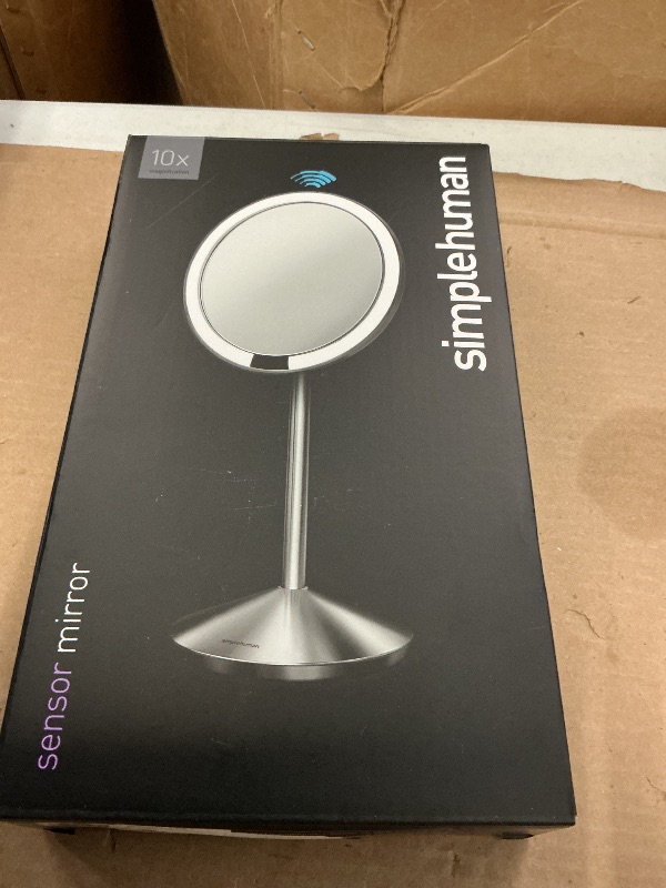 Photo 1 of simplehuman Sensor Mirror, 5" Round Rechargeable Mini Travel Makeup Mirror, 10x Magnification, Brushed Stainless Steel
