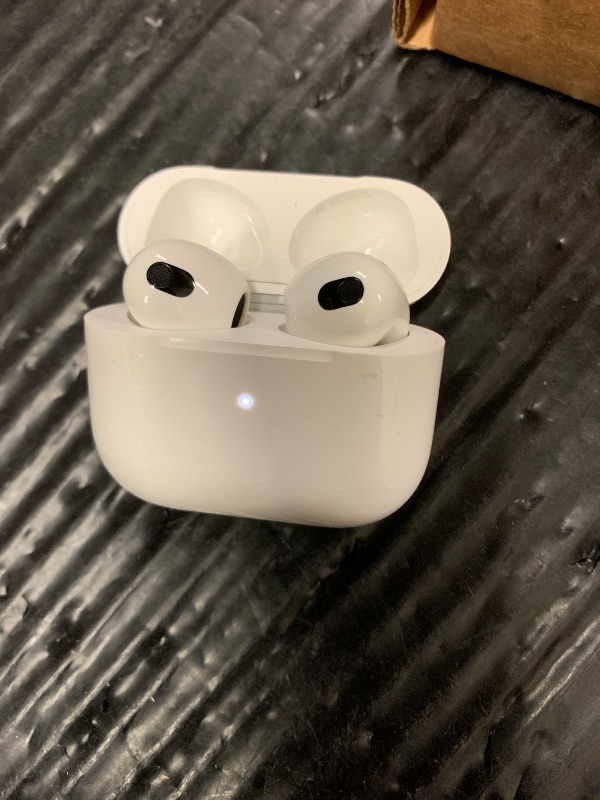 Photo 1 of Apple AirPods (3rd Generation) Wireless Ear Buds, Bluetooth Headphones, Personalized Spatial Audio, Sweat and Water Resistant, Lightning Charging Case Included, Up to 30 Hours of Battery Life