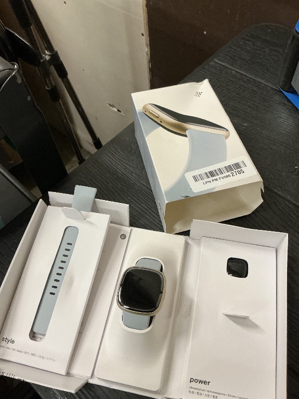 Photo 1 of Fitbit Sense 2 Advanced Health and Fitness Smartwatch with Tools to Manage Stress and Sleep, ECG App, SpO2, 24/7 Heart Rate and GPS, Blue Mist/Pale Gold, One Size (S & L Bands Included)