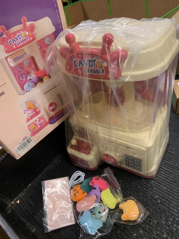 Photo 1 of 25PCS 2 in 1 Large Claw Machine, with Music & Light, Party Birthday for 3-14 Kids Gift, for Real Money Savings and Grabber Prize Dispenser Toys, Pink
