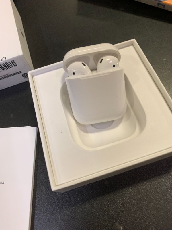 Photo 1 of Apple AirPods Wireless Ear Buds, Bluetooth Headphones with Lightning Charging Case Included, Over 24 Hours of Battery Life, Effortless Setup for iPhone