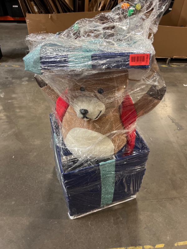 Photo 1 of Holiday Living 4-ft Animatronic LED Reindeer in Giftbox Yard Decoration