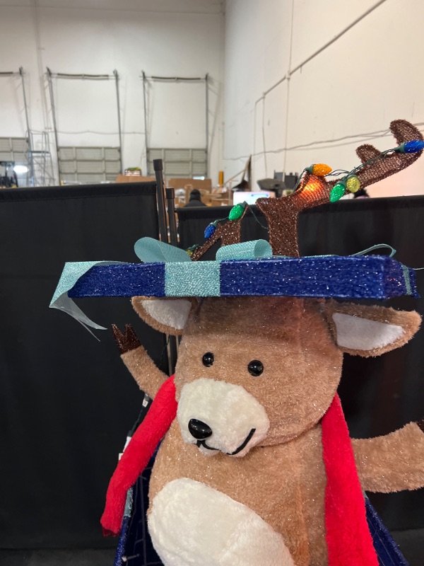 Photo 1 of Holiday Living 4-ft Animatronic LED Reindeer in Giftbox Yard Decoration