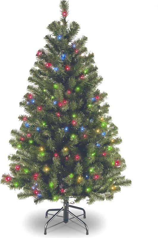 Photo 1 of National Tree Company 4.5 ft Pre-Lit North Valley Spruce Artificial Christmas Tree, 200 Multicolor Lights, 398 Tips, Includes Stand, Green
