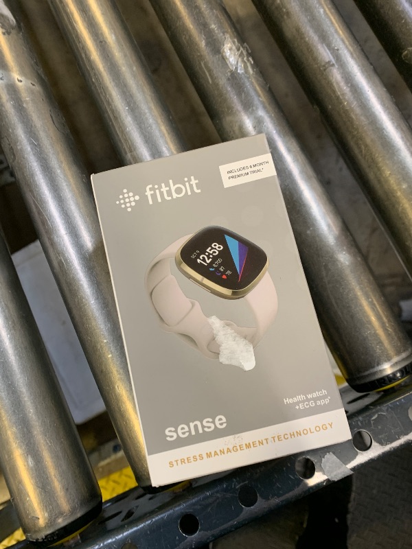 Photo 1 of Fitbit Sense Advanced Smartwatch with Tools for Heart Health, Stress Management & Skin Temperature Trends, White/Gold, One Size (S & L Bands Included)