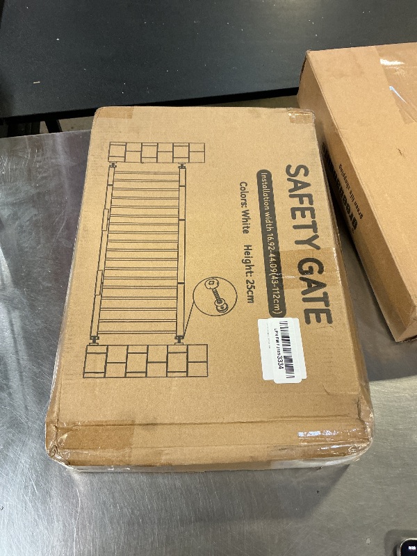 Photo 1 of Metal Dog Gate for Small Dogs, 17"- 44" Adjustable Extra Wide Gate to Step Over, 10'' Tall Short Dog Pet Gate with 4 Extension Kits, Pressure Mounted Indoor Outdoor Pet Gate for Doorways & Stairs