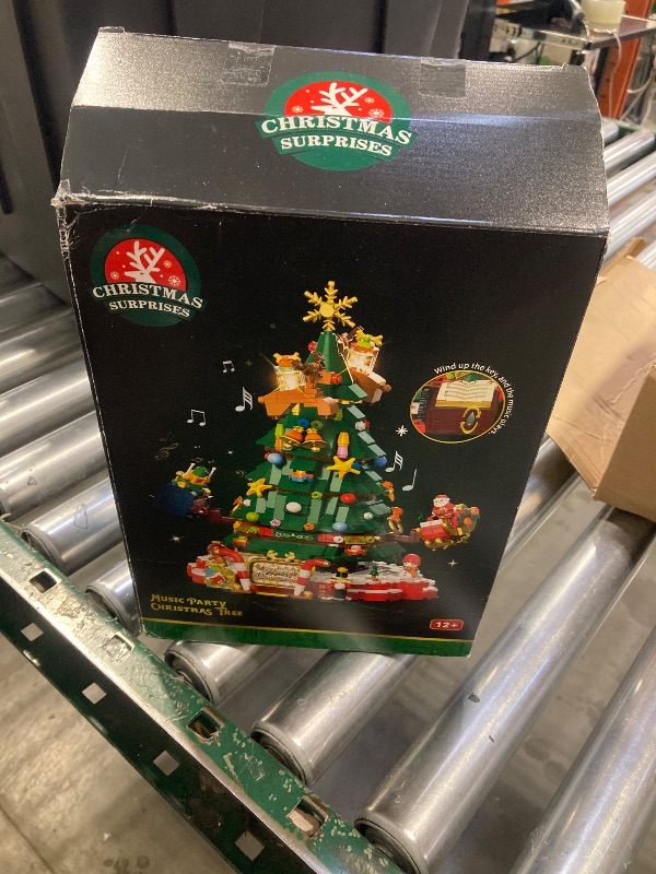 Photo 1 of JAKI Christmas Tree Building Set, Rotating Music Box Christmas Tree with Lights, Christmas Decorations for Tabletop & Home, for Boys & Girls Ages 8+