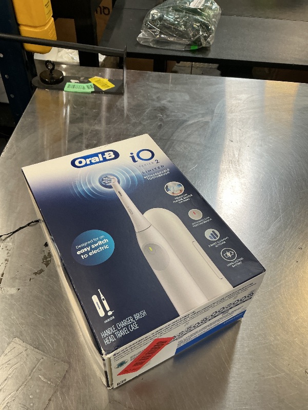 Photo 1 of Oral-B iO Simple Clean Rechargeable Electric Powered Toothbrush, Pure White with 1 Gentle Care Brush Head and 1 White Travel Case - Automatic Pressure Sensor to Protect Gums - 3 Modes -2 Min Timer