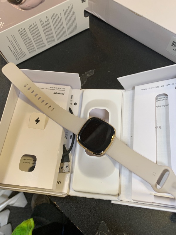 Photo 1 of Fitbit Sense Advanced Smartwatch with Tools for Heart Health, Stress Management & Skin Temperature Trends, White/Gold, One Size (S & L Bands Included)