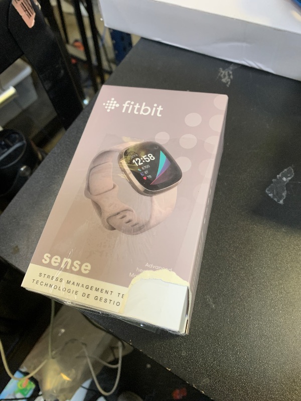 Photo 1 of Fitbit Sense Advanced Smartwatch with Tools for Heart Health, Stress Management & Skin Temperature Trends, White/Gold, One Size (S & L Bands Included)