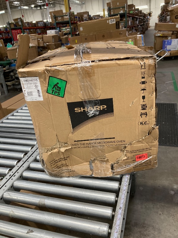 Photo 1 of ***It is used, it works and has several dents on the front and is missing parts***SHARP SMO1461GS Over the Range Microwave Oven with 12.8" Carousel Turntable, 24-inch, 1.4 Cubic Feet, 1,000 Watt, Sensor Cooking, Edge to Edge Black Glass with Stainless Ste
