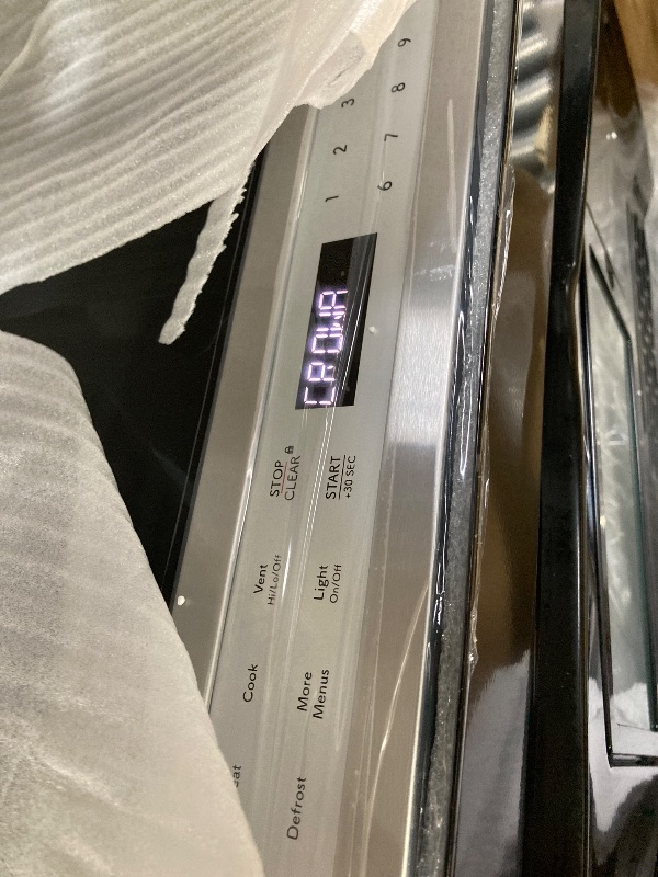 Photo 1 of ***It is used, it works and has several dents on the front and is missing parts***SHARP SMO1461GS Over the Range Microwave Oven with 12.8" Carousel Turntable, 24-inch, 1.4 Cubic Feet, 1,000 Watt, Sensor Cooking, Edge to Edge Black Glass with Stainless Ste
