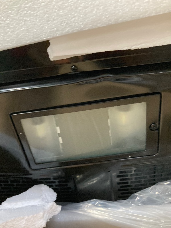 Photo 1 of ***It is used, it works and has several dents on the front and is missing parts***SHARP SMO1461GS Over the Range Microwave Oven with 12.8" Carousel Turntable, 24-inch, 1.4 Cubic Feet, 1,000 Watt, Sensor Cooking, Edge to Edge Black Glass with Stainless Ste