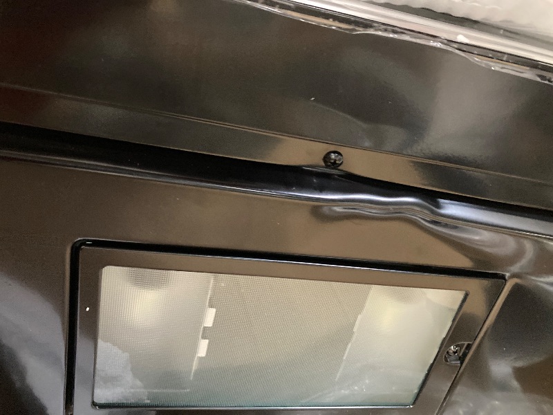 Photo 1 of ***It is used, it works and has several dents on the front and is missing parts***SHARP SMO1461GS Over the Range Microwave Oven with 12.8" Carousel Turntable, 24-inch, 1.4 Cubic Feet, 1,000 Watt, Sensor Cooking, Edge to Edge Black Glass with Stainless Ste