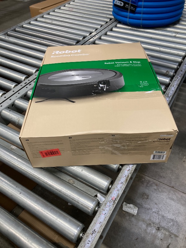 Photo 1 of **IT IS USED, IT IS CONNECTED AND TURNS ON, BUT IT IS NOT KNOWN IF IT WORKS 100%, IT IS MISSING A PART**iRobot Roomba Combo j5 Robot Vacuum and Mop with Dirt Detect Technology, 4-Stage Cleaning System, and Alexa, Siri, and Google Assistant-Enabled Cleanin